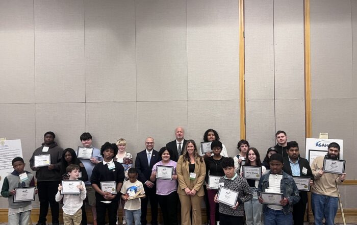 Student artists proudly showcasing their winning certificates at the ASAH Special Education Day, where their creativity and artistic talents were celebrated.